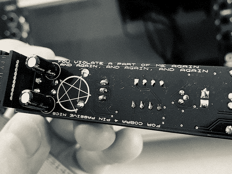text on the PCB of X1L3 nihil CB mic module saying you violate a part of me again and again